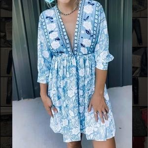 Blue floral dress. Has tie in back. Low cut